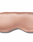 A beige 100% mulberry silk sleep mask with adjustable straps.